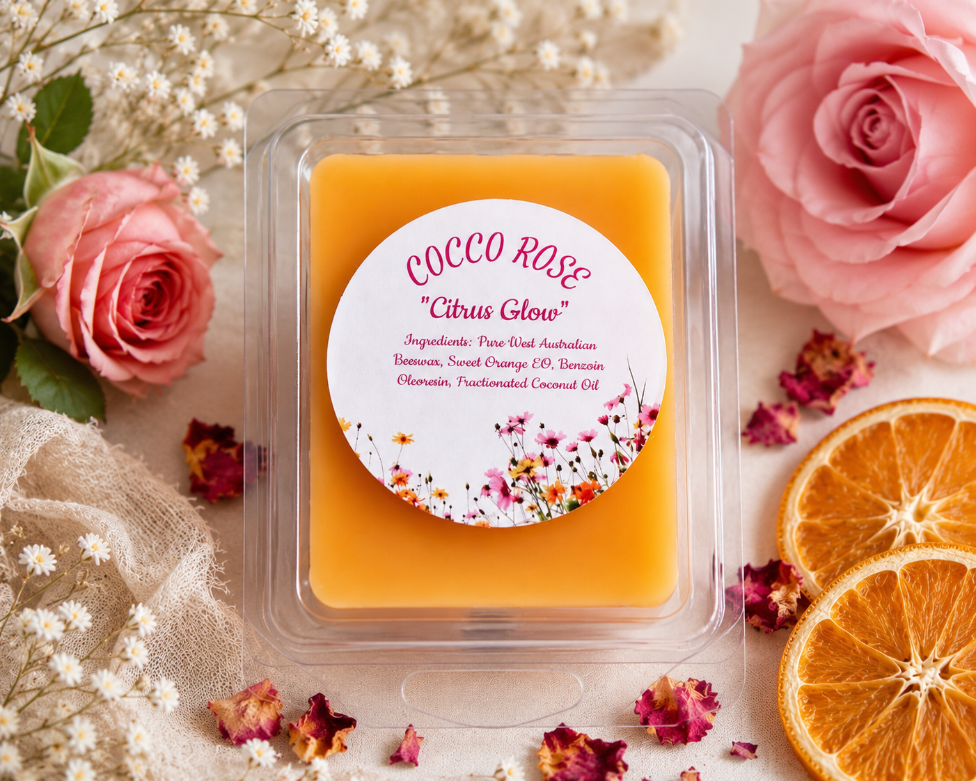 Clamshell wax melts on a beautifully decorated table with roses and oranges - Cocco Rose Citrus Glow